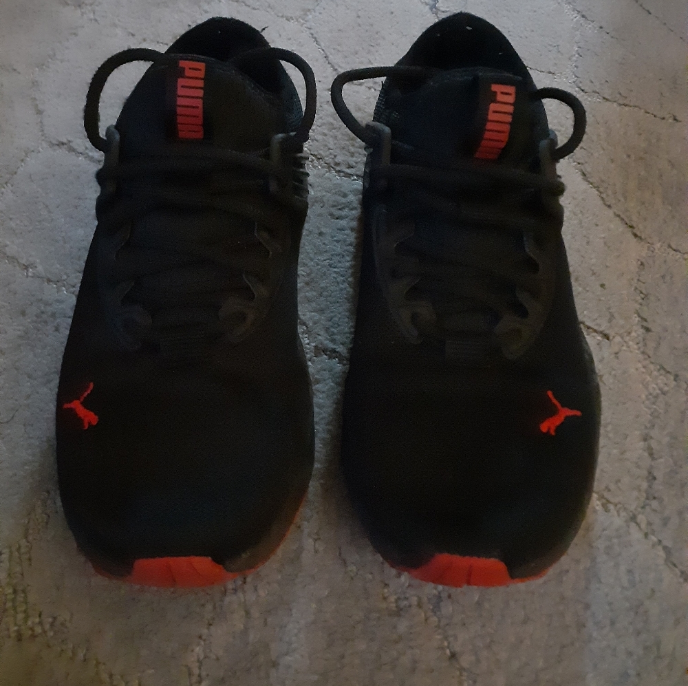 Puma boys size 5.5, lightly used, good condition, black and red.